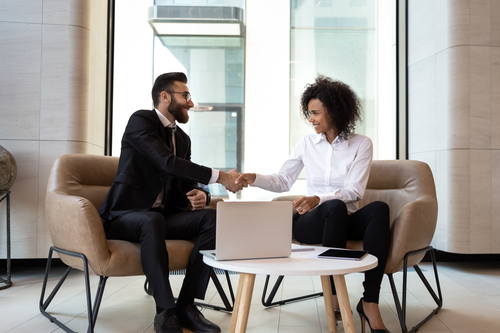 two businesspeople shaking hands