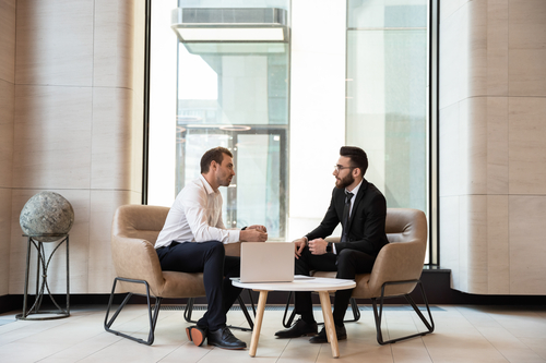 Two businessmen talking