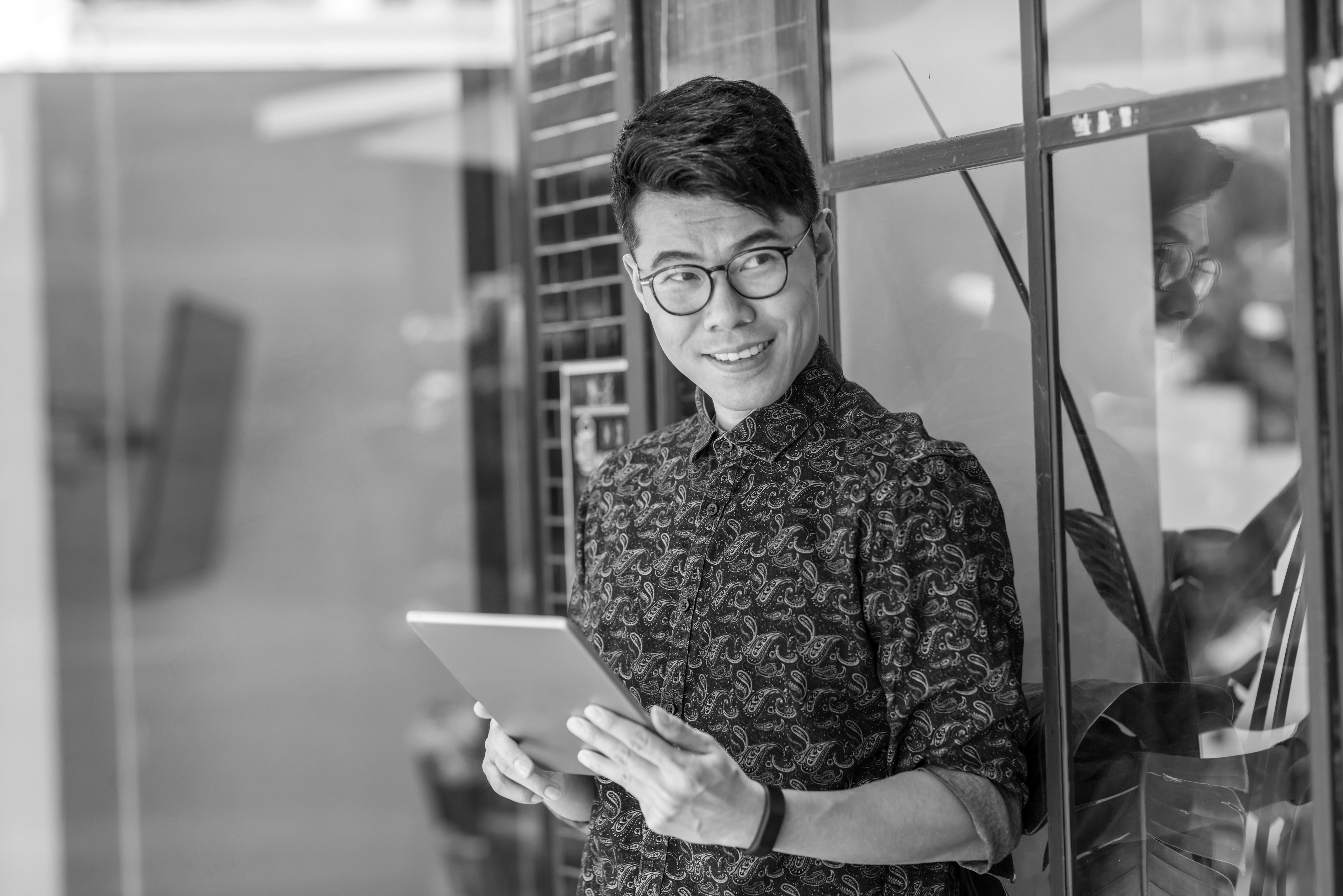 asian man with laptop
