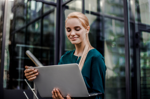 businesswoman holding a laptop