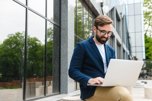 businessman typing on a laptop