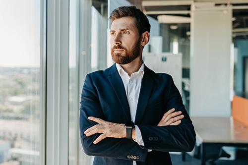 successful-businessman-formal-wear-standing-folded
