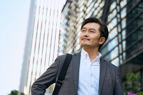 successful-asian-corporate-executive-walking-central