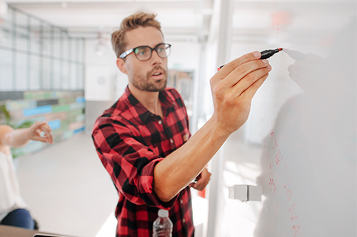 casual-young-executive-giving-presentation-on