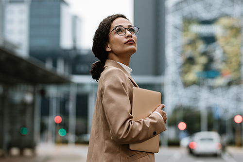 businesswoman-digital-tablet-looking-over-her
