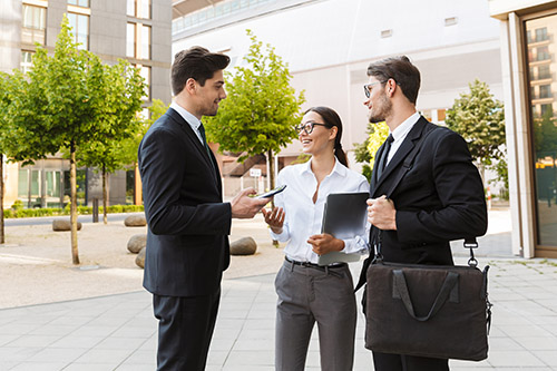 office-colleagues-talking-outdoors-city-streets