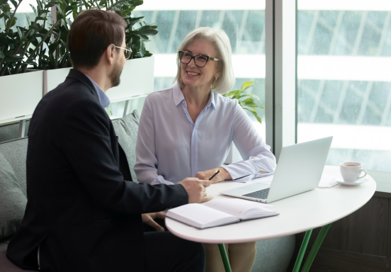 Work colleagues talking in modern office