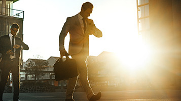 A businessman walking outdoors