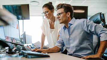 Two business colleagues working in their office
